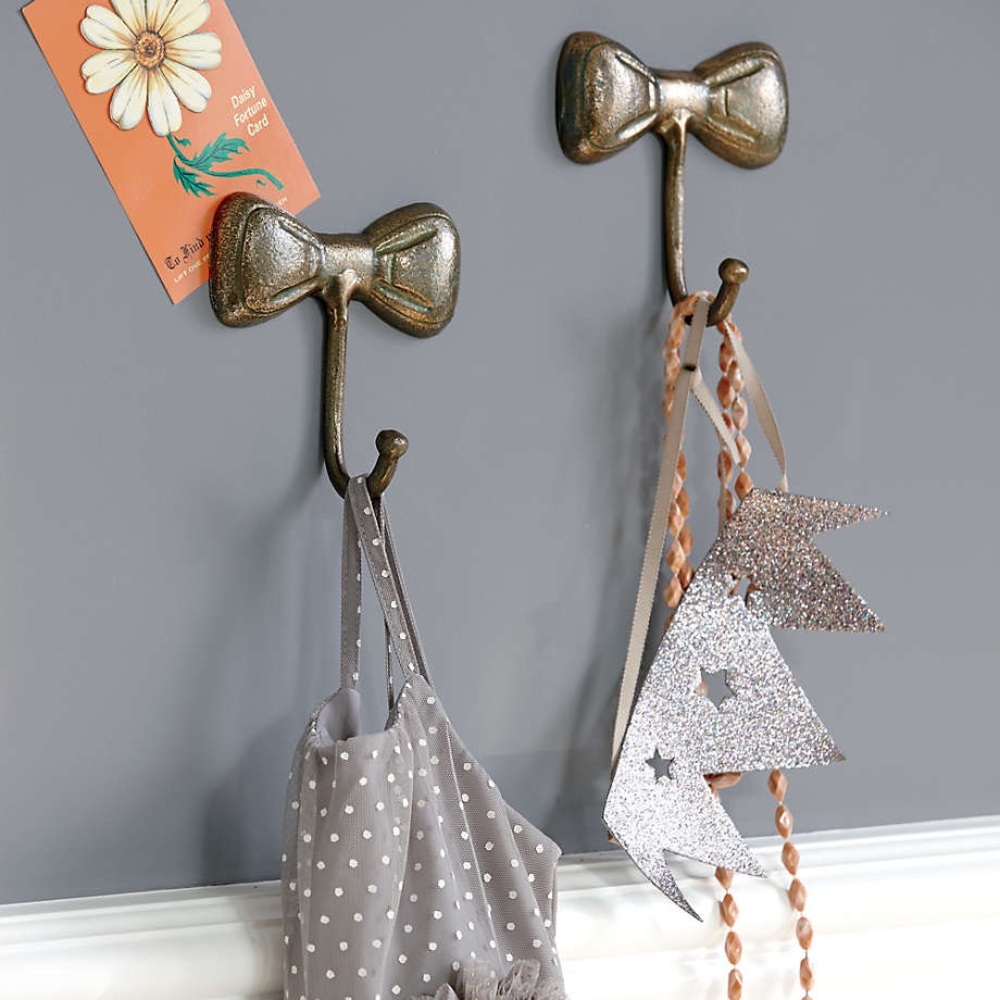 2 Crate&Barrel bow hooks, gold metal